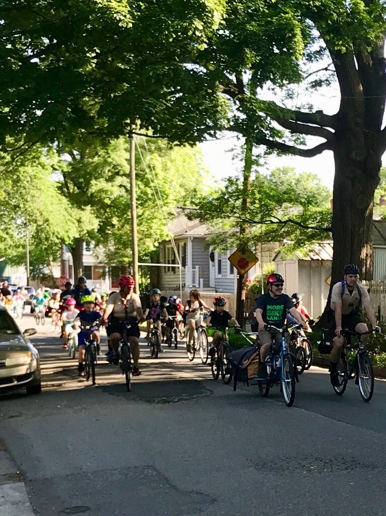 Students and caregivers riding bikes to Linwood Holton Elementary School on Bike to School Day 2019.